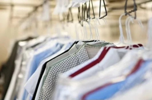 Freshly cleaned garments on the rack at Waite's Cleaners
